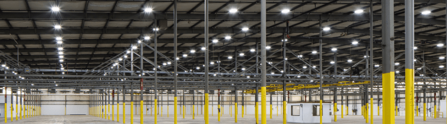well-lit kirby warehouse showcasing 30 foot ceilings and racks for storage